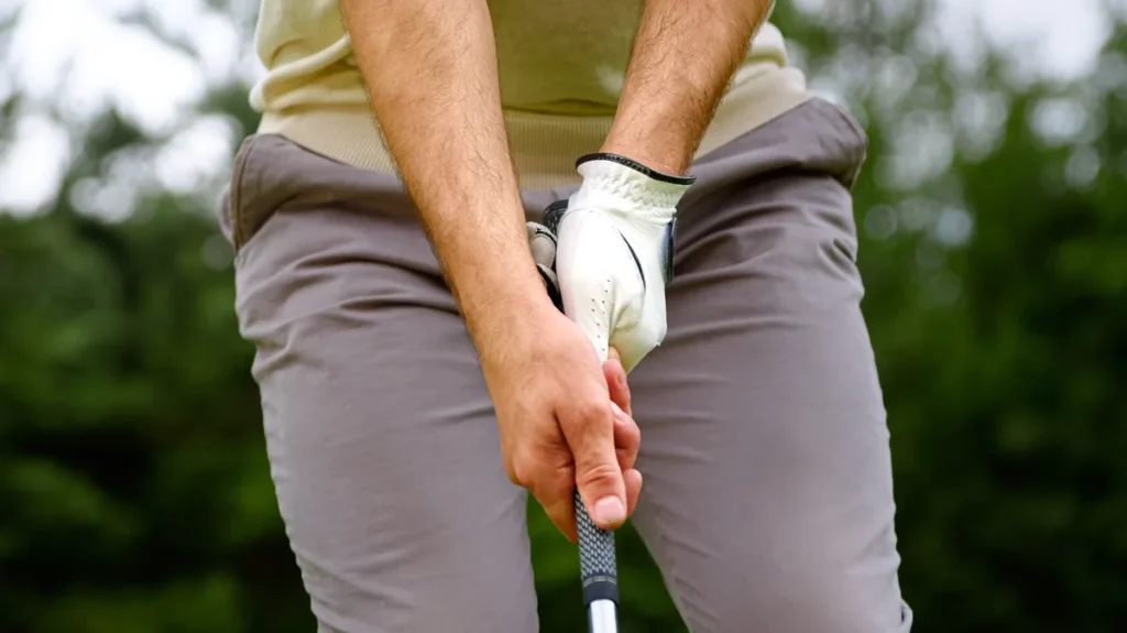 Regripping a golf club at home with grip tape and solvent